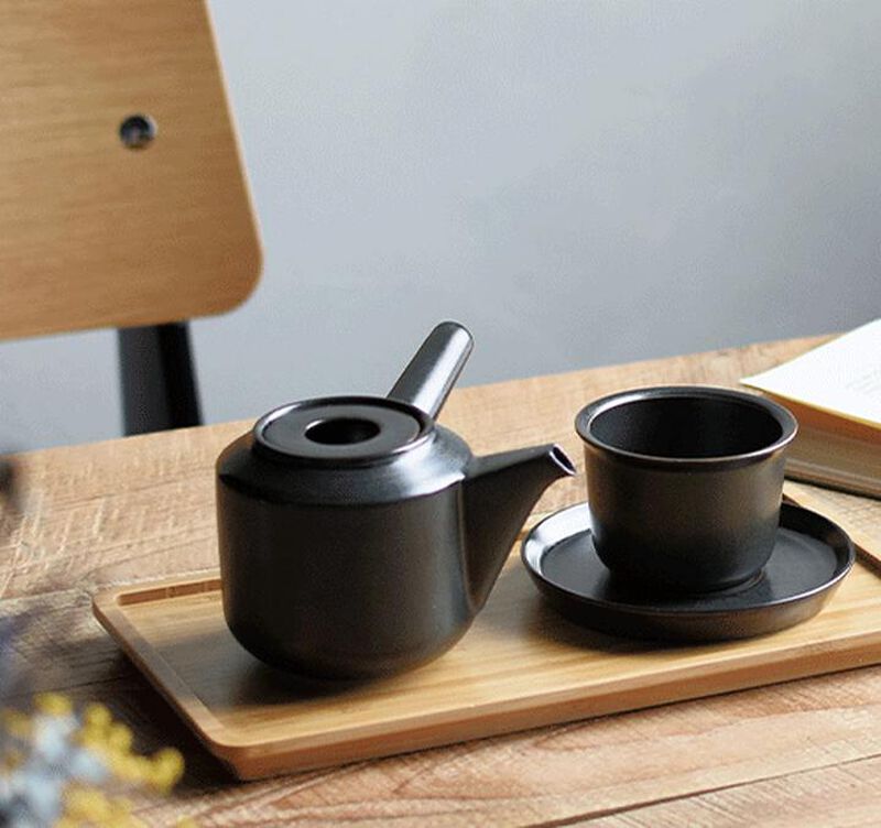 Tea Cup and Saucer "Leaves to Tea" in Black  - Kinto image number 1