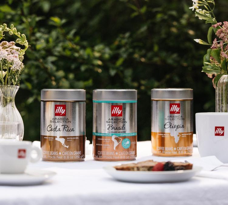 overview of the illy arabica selection range with several tins from costa rica and ethiopia