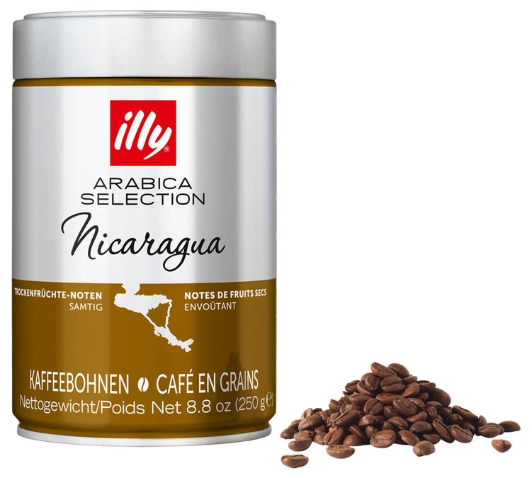 tin of illy arabica selection nicaragua coffee beans with dark roasted beans